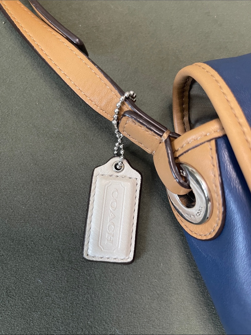Coach Hadley leather crossbody bag in a navy, tan, and white colorblock design. - Picture 7 of 11